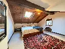 ELISE_Steinhaus_09_Dachschlafzimmer_weit.webp